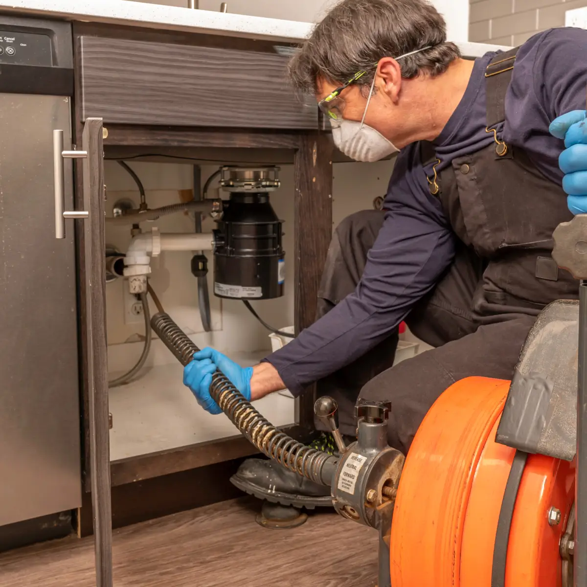 chinook plumbing plumber snaking a kitchen drain