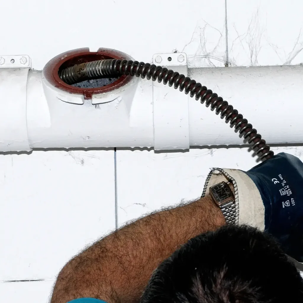 chinook plumbing plumber snaking a commercial kitchen drain line